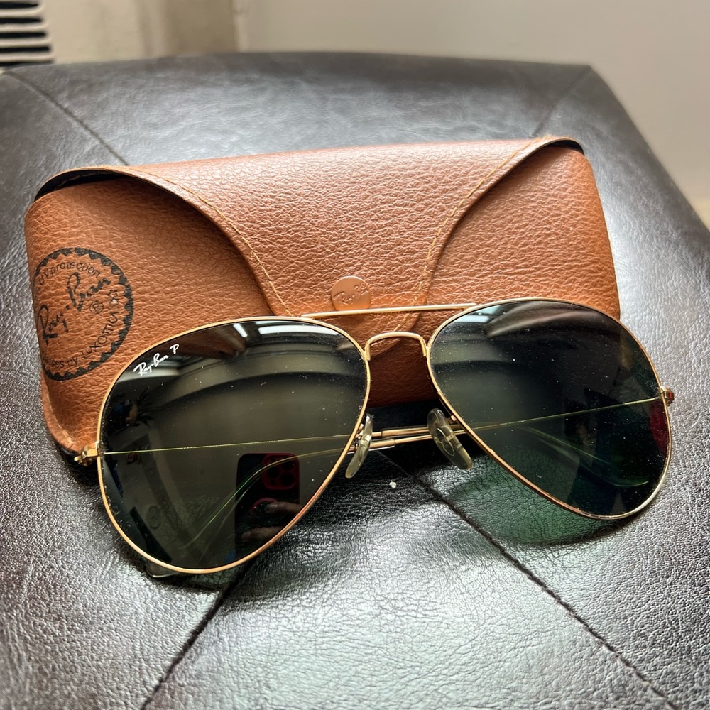 Gold trim authentic Ray Ban sunnies.